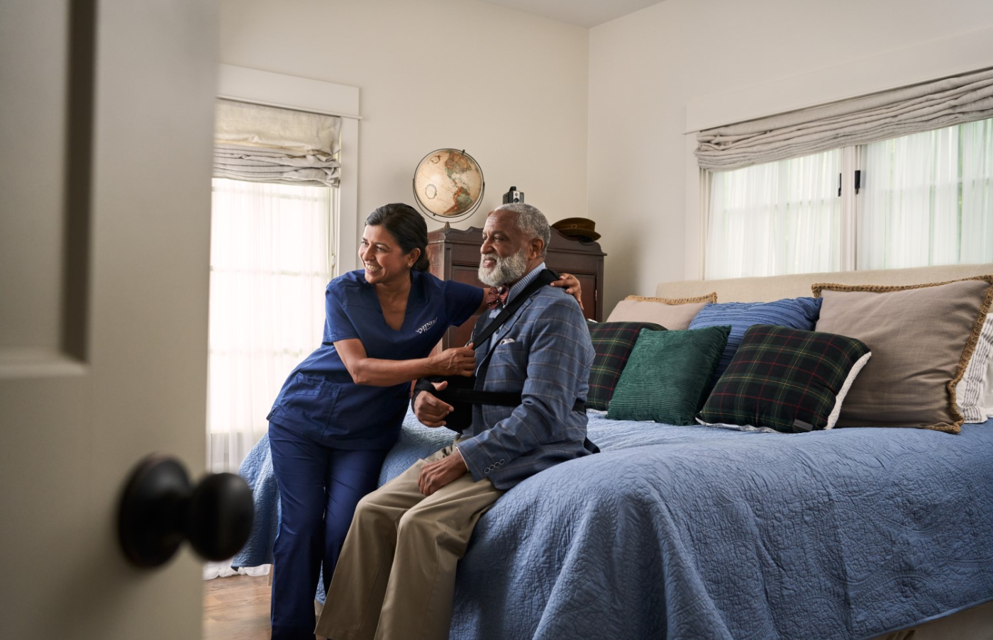 SYNERGY-HomeCare-caregiver-helping-client-get-dressed SYNERGY-HomeCare-caregiver-helping-client-get-dressed